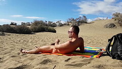 Public handjob in the dunes of Gran Canaria Thumb