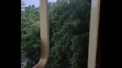 Husband fucking wife in doggy style by enjoying the rain from window Thumb